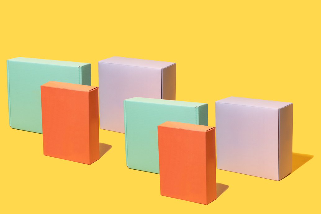 Colorful Cardboard Boxes on Yellow Background